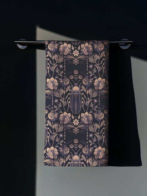 Set of four navy blue dining napkins featuring golden scarab beetles and botanical illustrations in a symmetrical pattern, sized 18x18 inches.